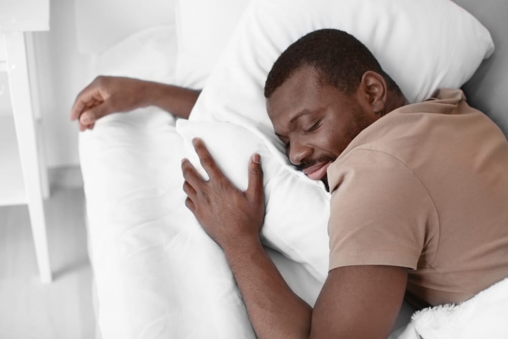 Man sleeping and smiling