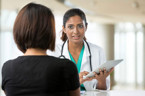 A doctor talking to a women