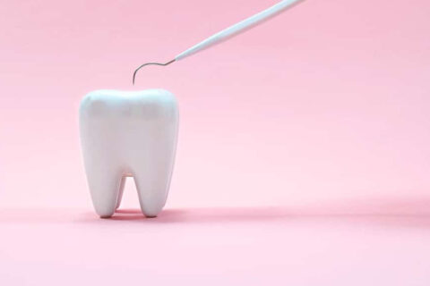 Tooth on a pink background