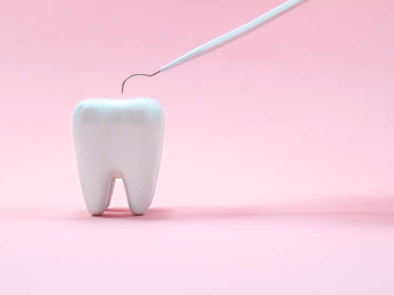 Tooth on a pink background