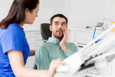 Patient looking at female dentist