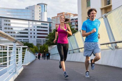 a person and person running on a bridge