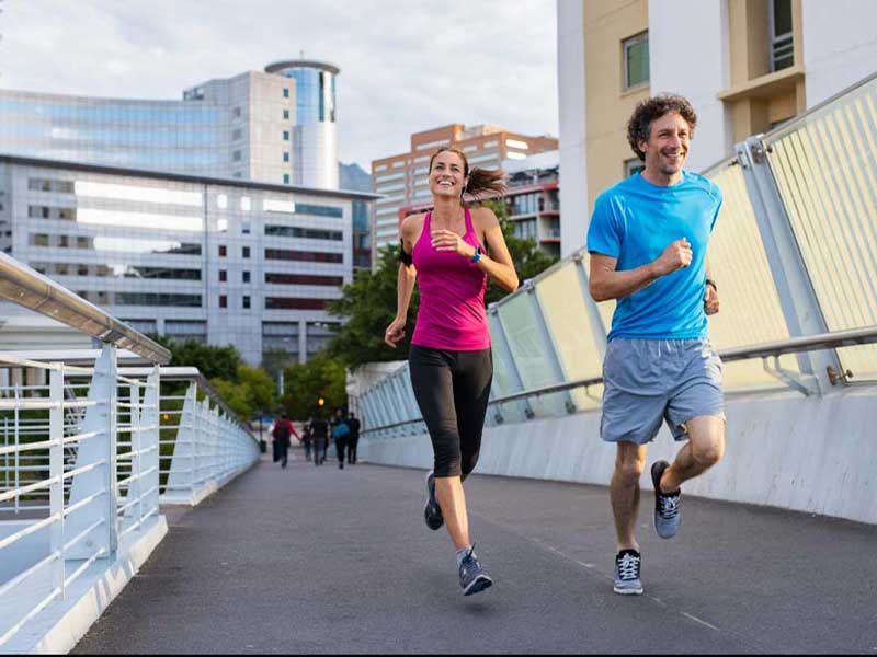 a person and person running on a bridge