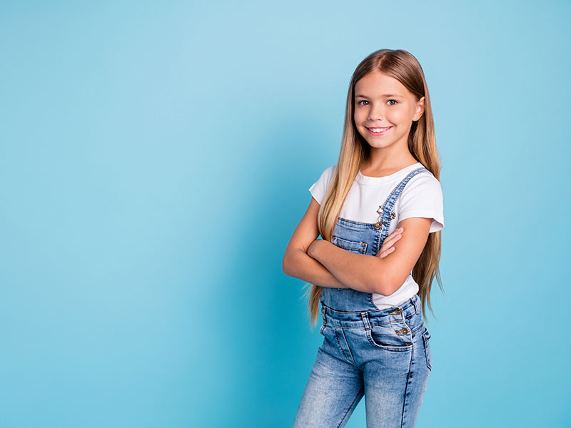 a girl standing and smiling