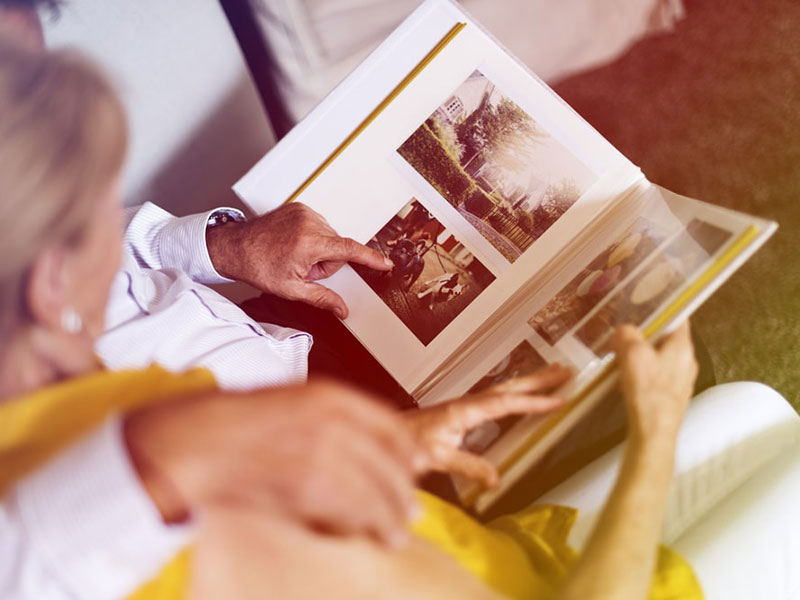 Couples viewing photo album