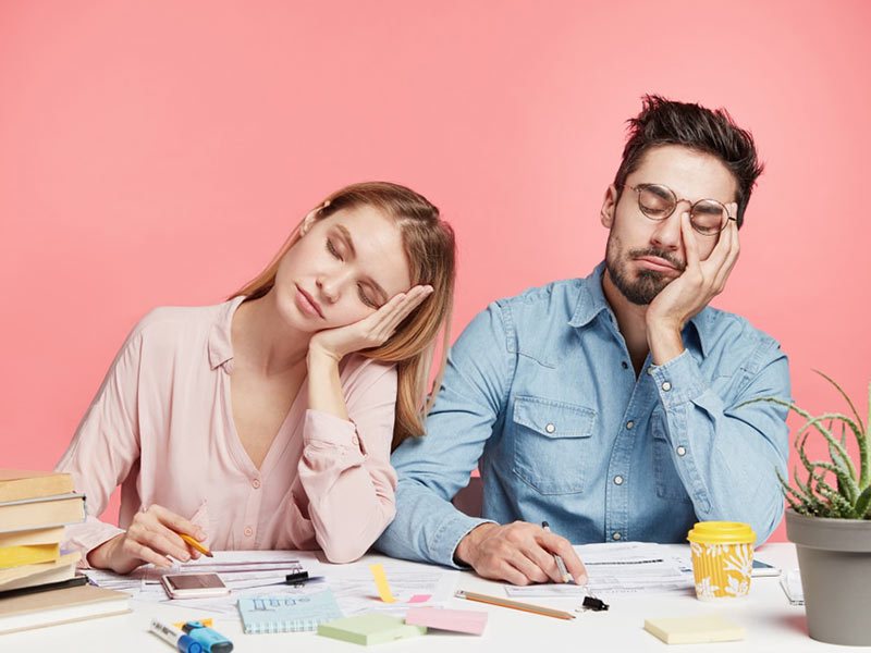 Two person sleeping while sitting 